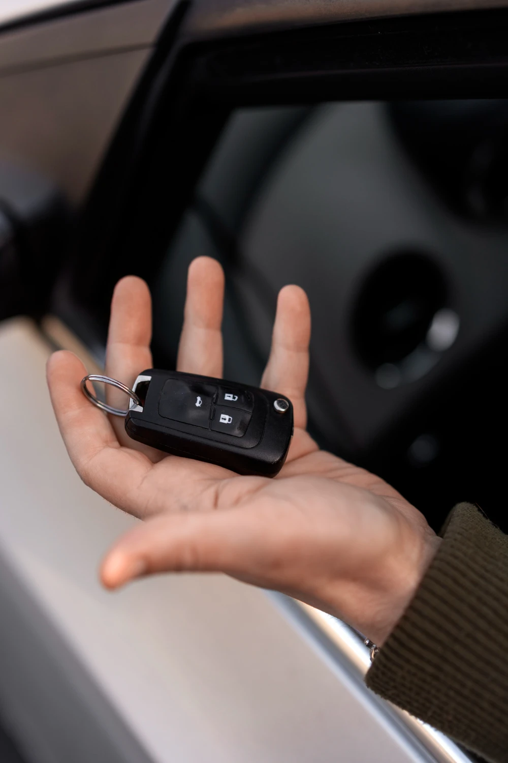 2150320963 High angle hand holding car key<br />